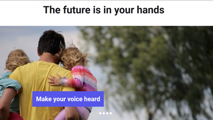 A screenshot of the Conference on the Future of Europe Website. A man holds two young children in his arms, and a text button reads, "Make your voice heard."
